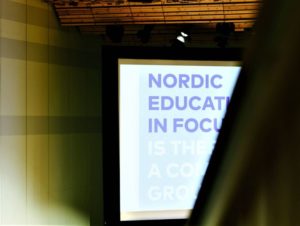 Picture of conference room, showing screen with text "Nordic Education in Focus"